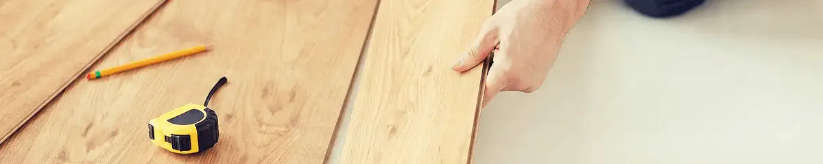 A professional installing wood flooring in Las Vegas, NV