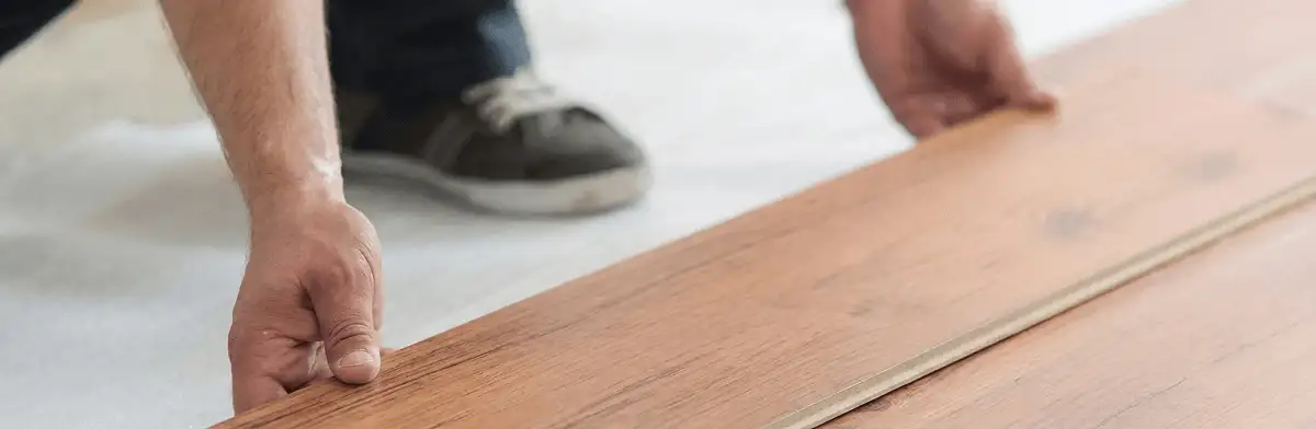 A professional installing laminate flooring in Las Vegas, NV