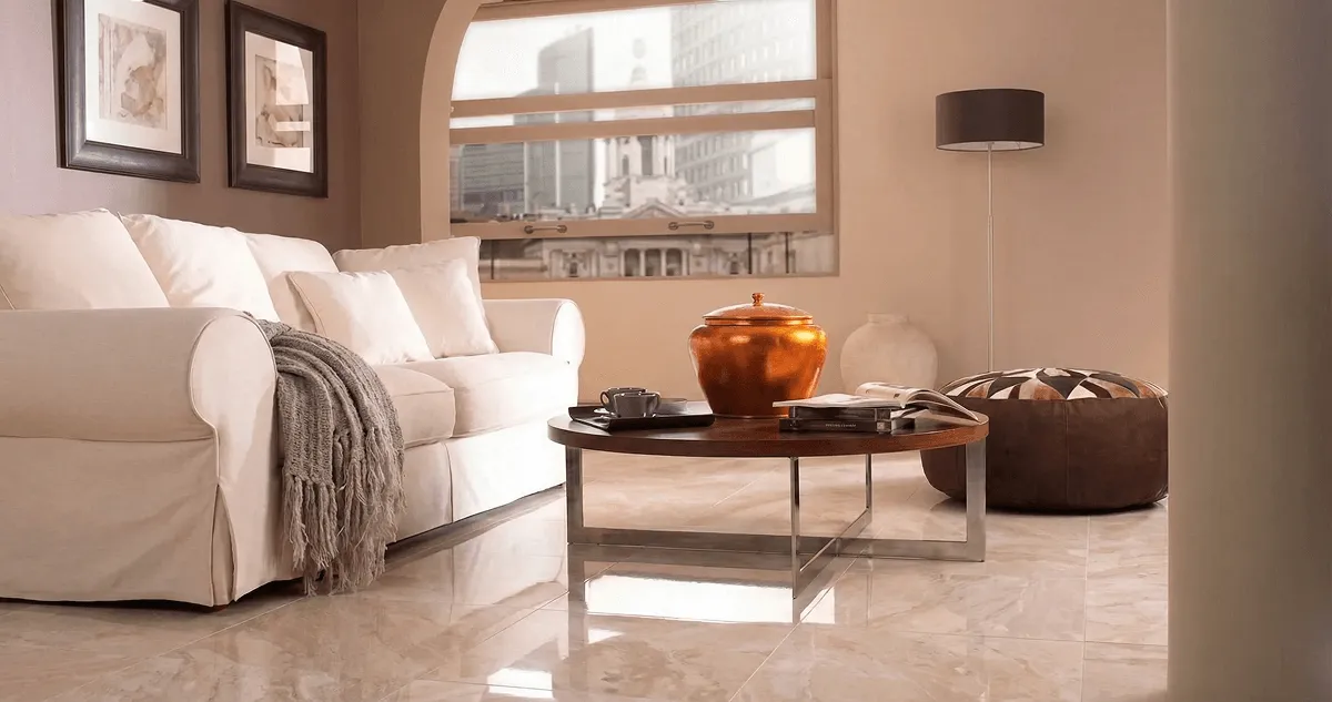 Modern living room with professionally installed marble flooring, a beige sofa, coffee table in Las Vegas, NV