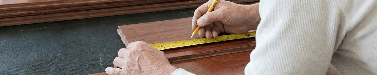 A professional installing wood flooring in Las Vegas, NV